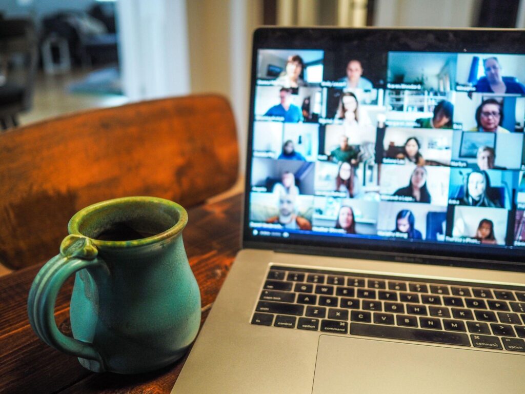 laptop computer showing group video call