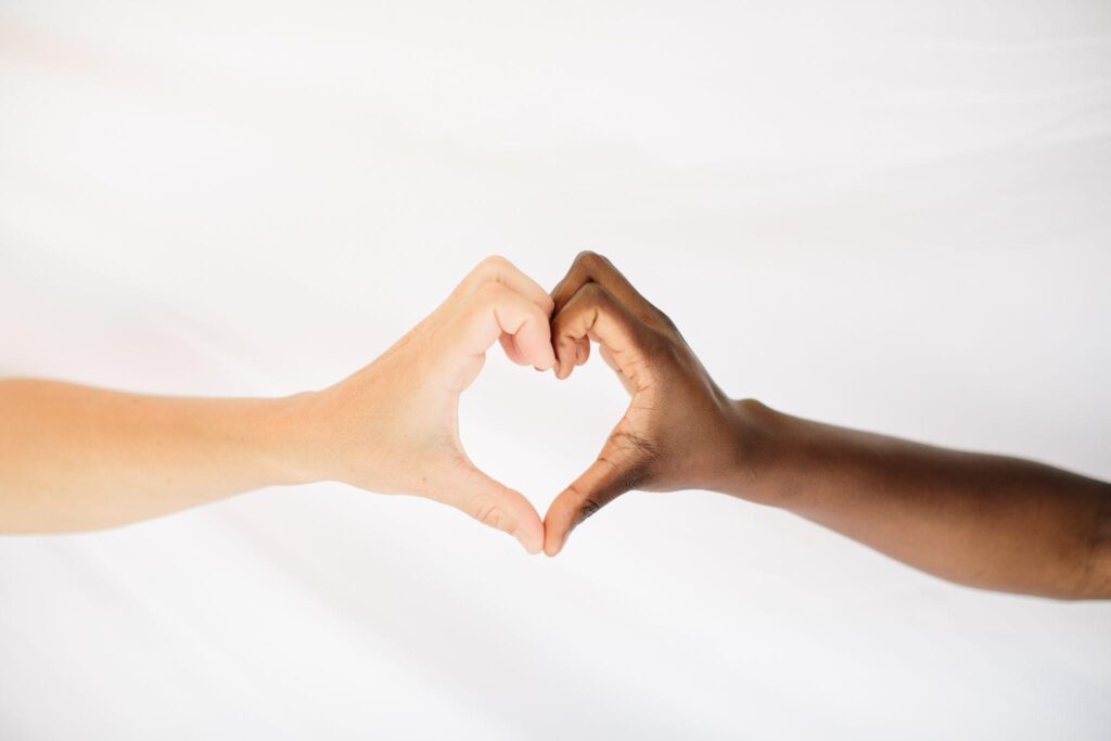 two hands pressed together to form a heart shape