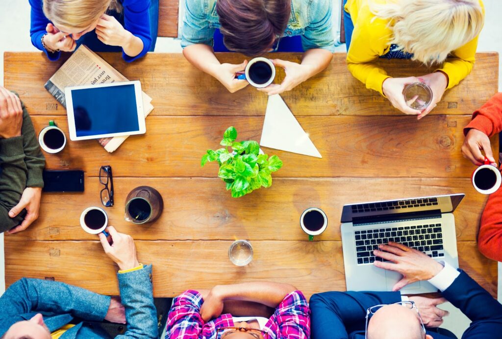 overhead view of a group of people meeting around a table